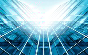 view looking up at the sky from where 2 outside walls of skyscrapers meet