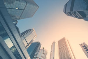 looking up at skyscrapers