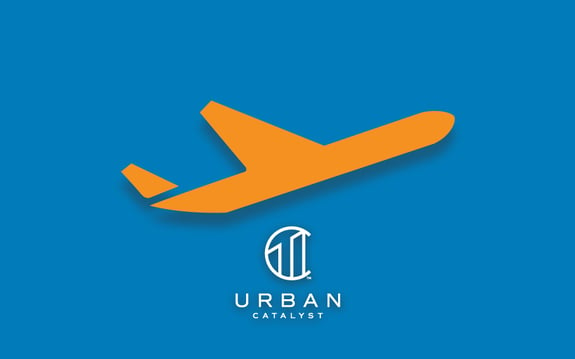 outline of an airplane and Urban Catalyst logo