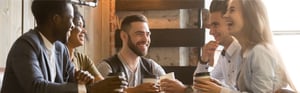 group of young professionals enjoying coffee