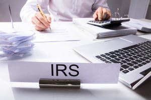 man at his desk at the IRS